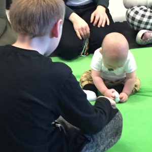 Baby looking down at the ground